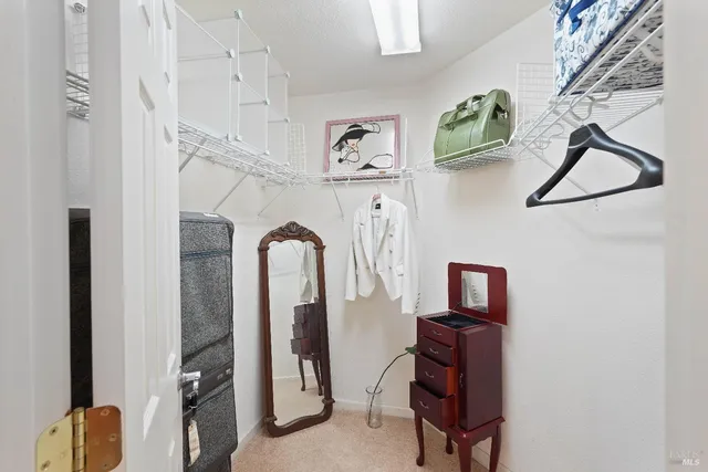 a bathroom with a granite countertop toilet and a sink