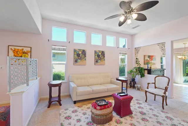 a living room with furniture and a rug