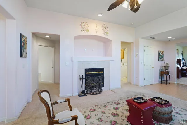 a living room with furniture and a fireplace