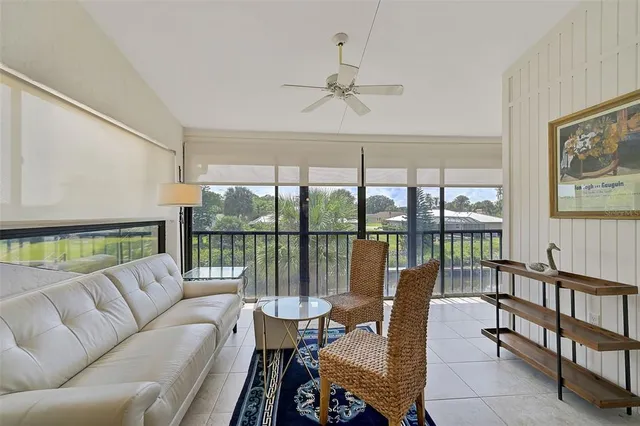 a dining room with furniture window and outside view