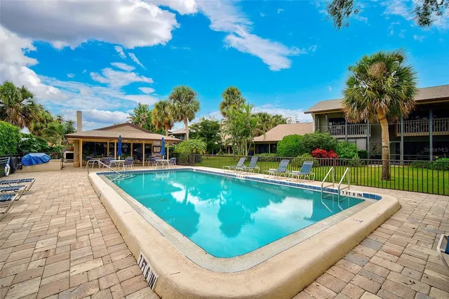 a view of a house with swimming pool