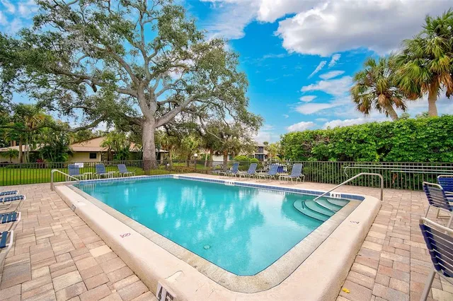 a view of swimming pool with lounge chair