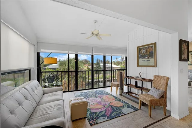 a bedroom with furniture and a floor to ceiling window