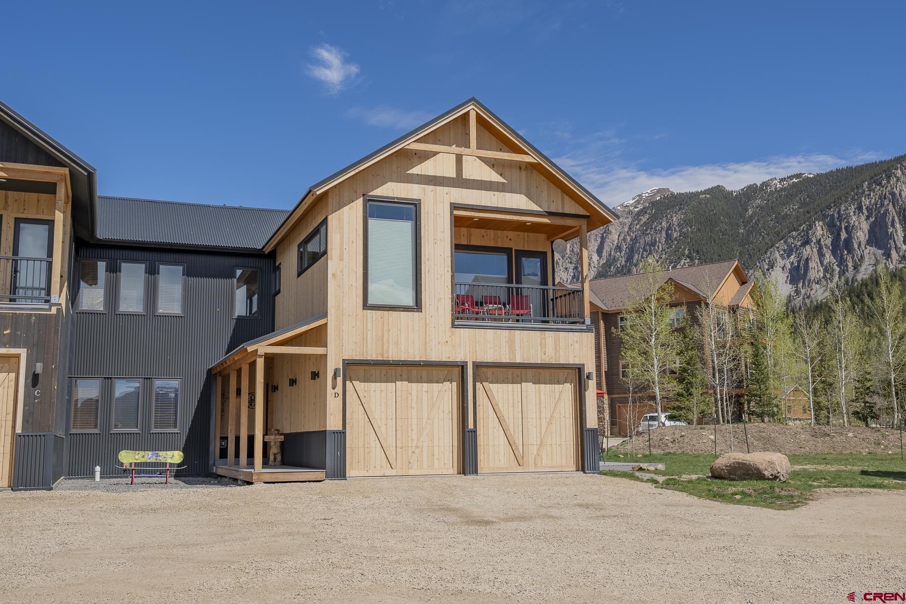 231 Elk Valley Road, Unit 2D Crested Butte, CO 81224 - Photo 1 of 35 a view of a house with a yard
