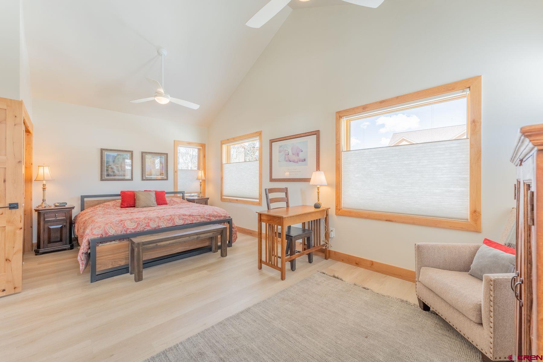 231 Elk Valley Road, Unit 2D Crested Butte, CO 81224 - Photo 17 of 35 a bedroom with a bed and a large window