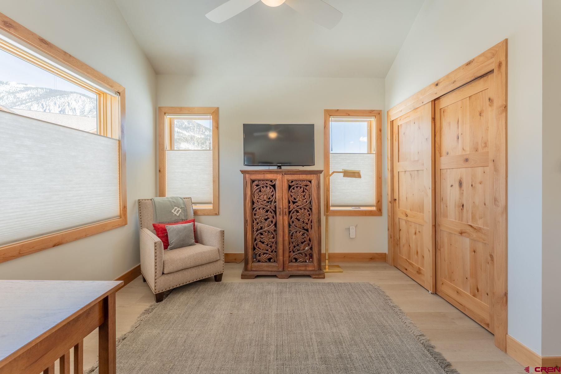 231 Elk Valley Road, Unit 2D Crested Butte, CO 81224 - Photo 19 of 35 a living room with furniture and a window