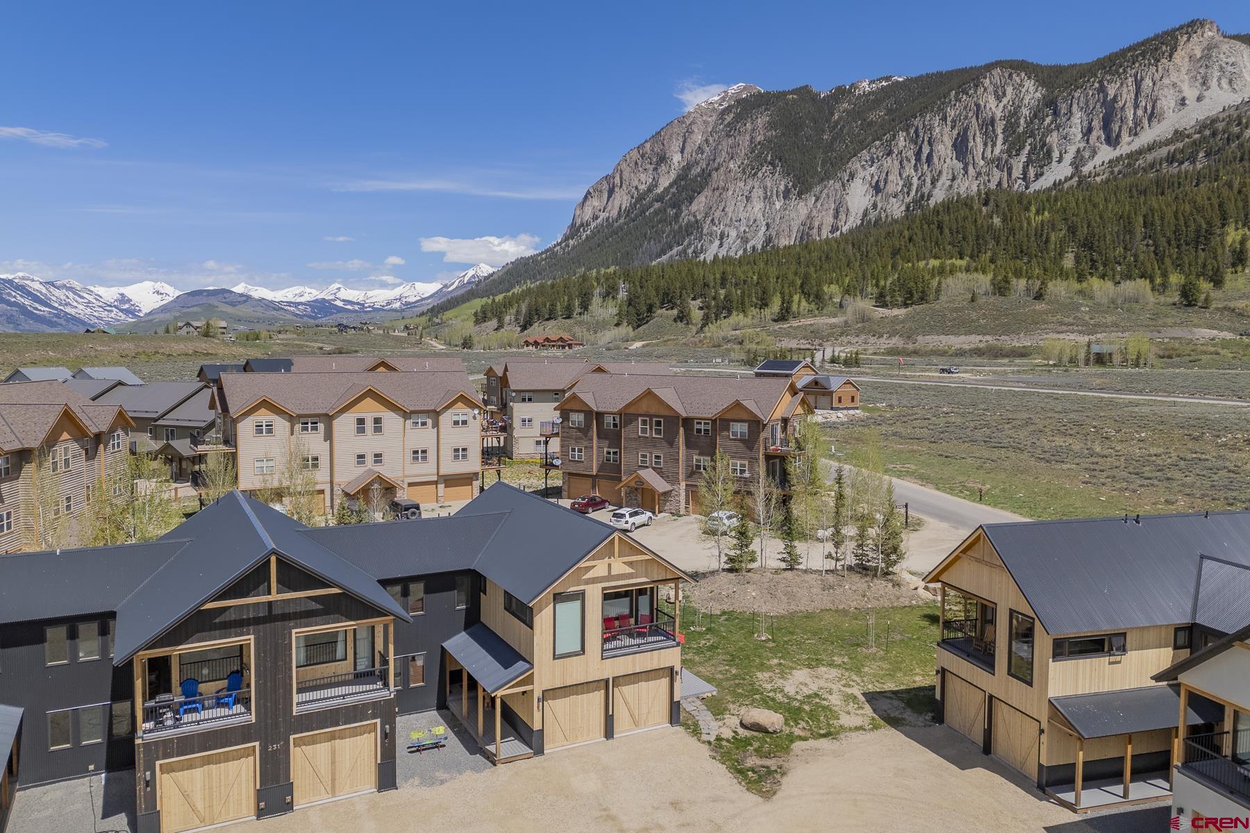 231 Elk Valley Road, Unit 2D Crested Butte, CO 81224 - Photo 2 of 35 an aerial view of a house with a ocean view