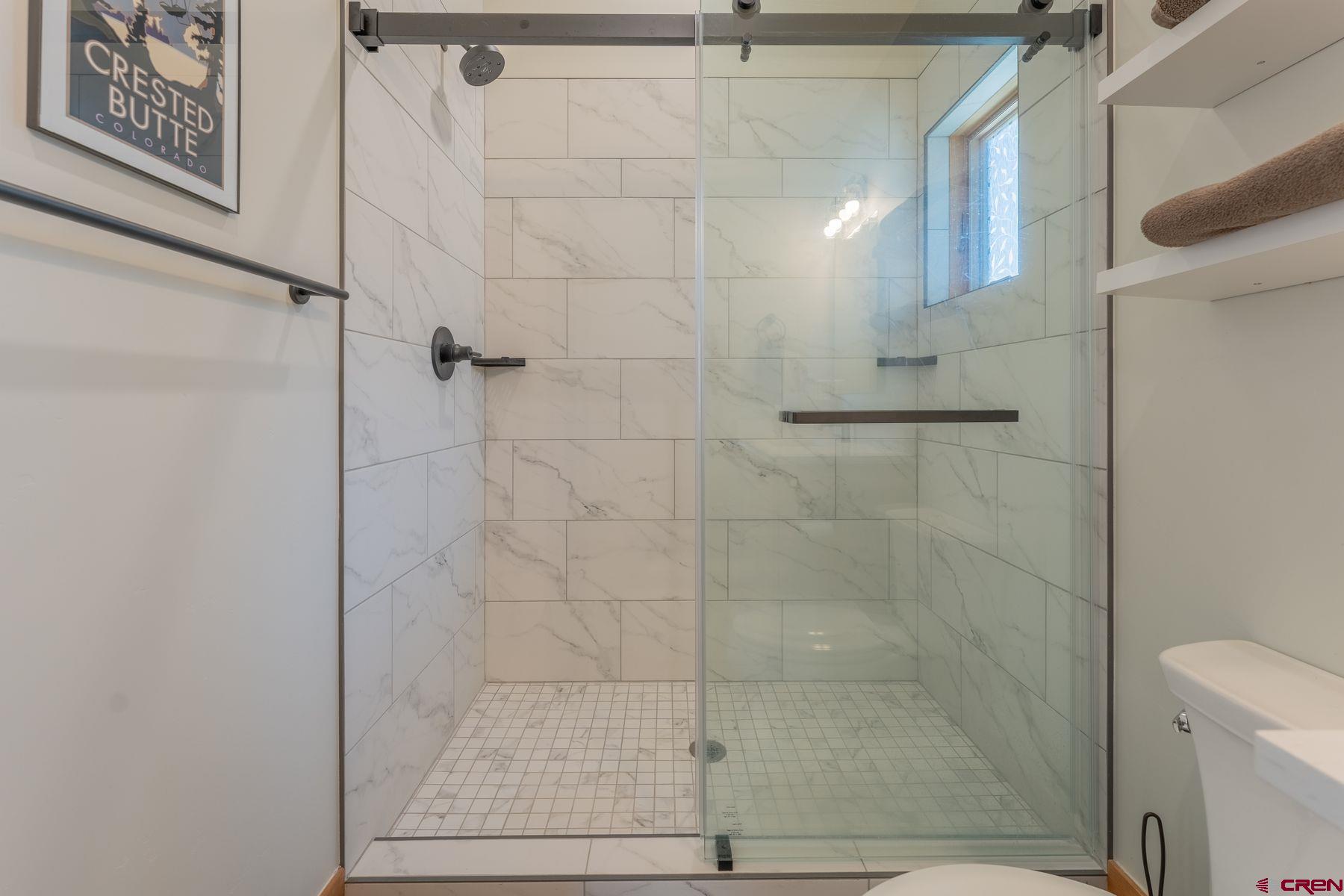 231 Elk Valley Road, Unit 2D Crested Butte, CO 81224 - Photo 21 of 35 a bathroom with a shower