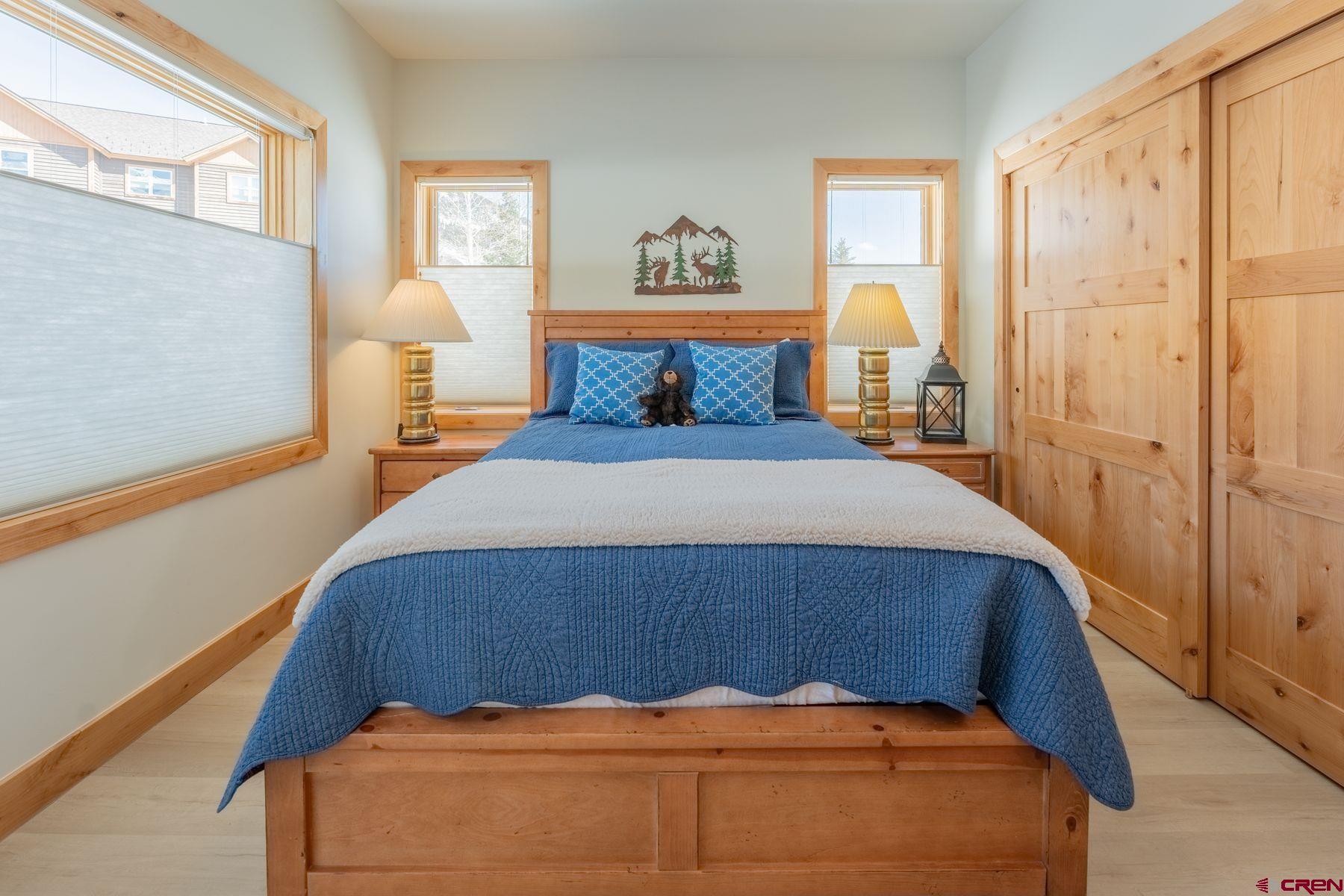 231 Elk Valley Road, Unit 2D Crested Butte, CO 81224 - Photo 22 of 35 a bedroom with bed and window