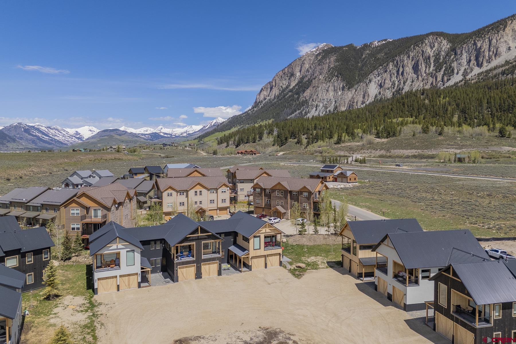 231 Elk Valley Road, Unit 2D Crested Butte, CO 81224 - Photo 30 of 35 a view of a lake with a mountain