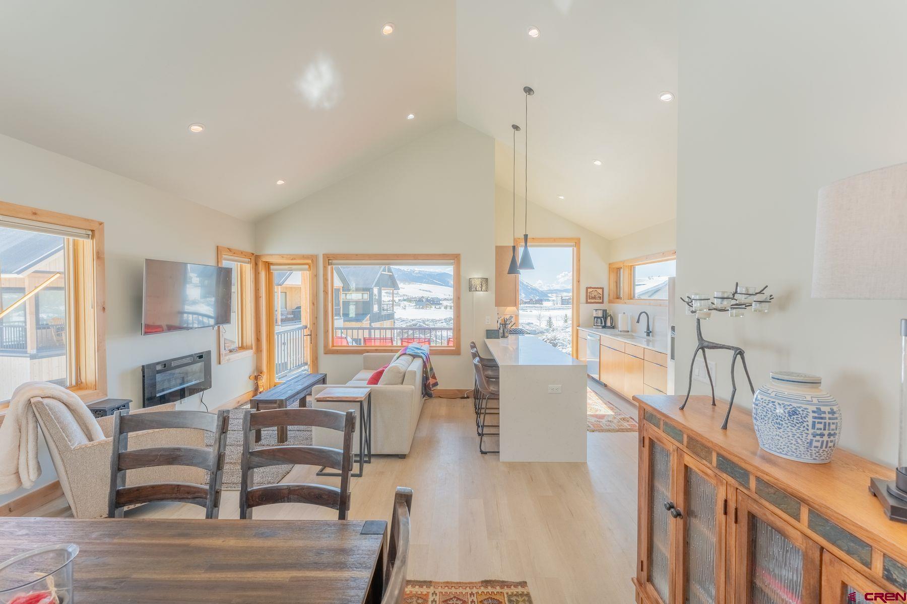 231 Elk Valley Road, Unit 2D Crested Butte, CO 81224 - Photo 6 of 35 a living room with furniture and a large window