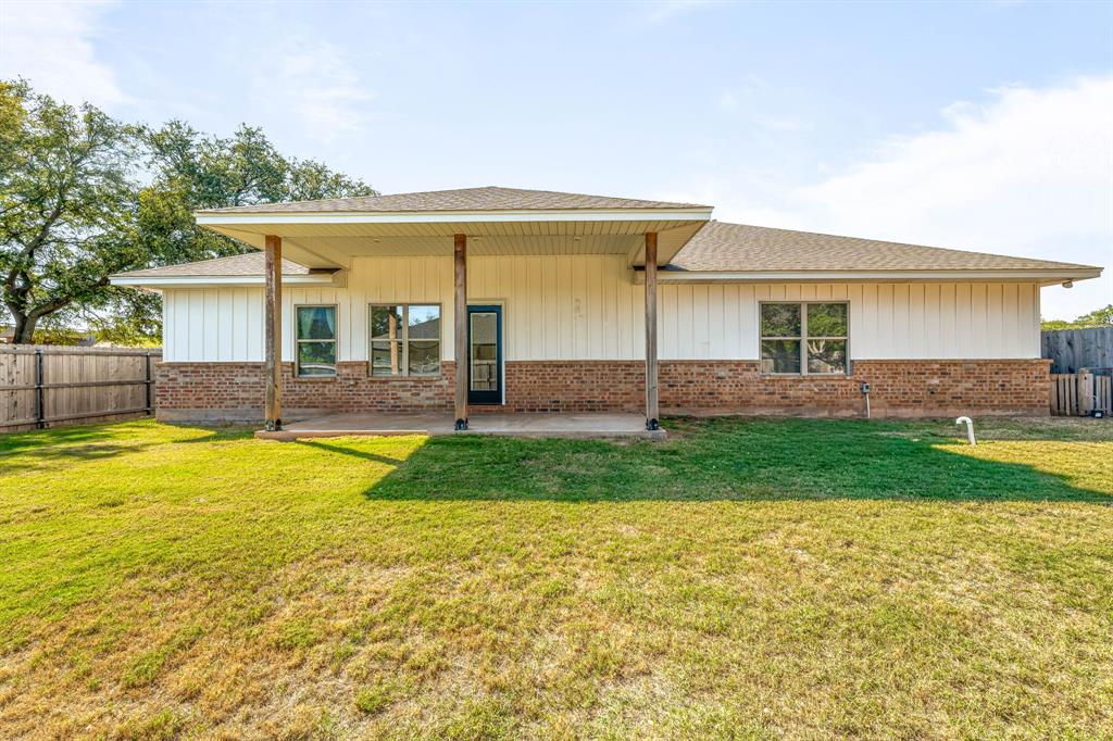 1501 Johnson Road, Unit A Iowa Park, TX 76367 - Photo 29 of 30 a view of a house with swimming pool and a yard