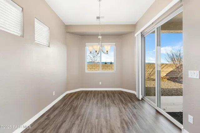 a room with window and wooden floor