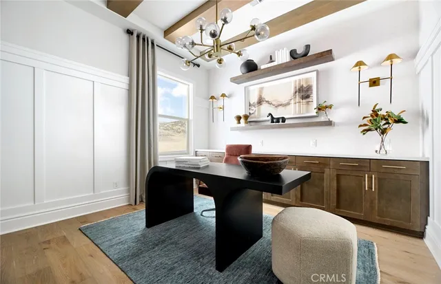 a kitchen with a sink refrigerator and cabinets