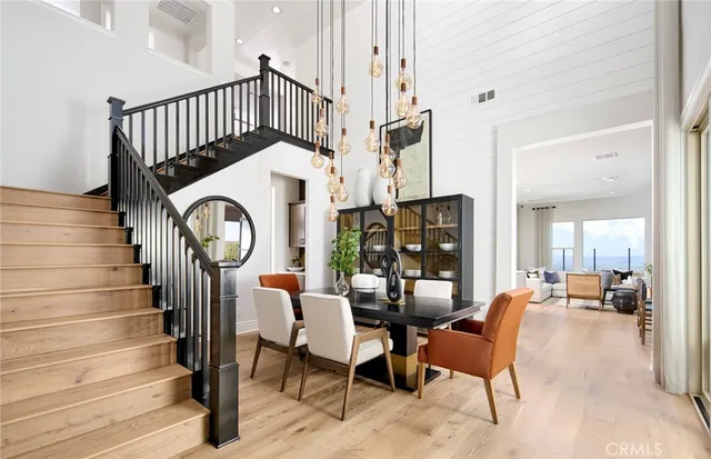 a view of a livingroom with furniture and staircase