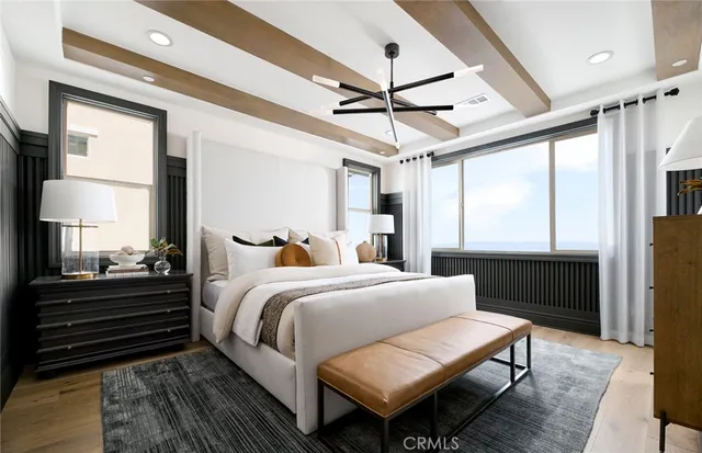 a bedroom with a bed a ceiling fan and a dresser