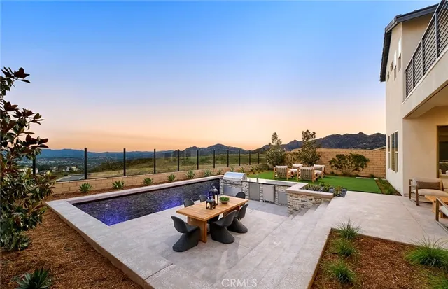 a terrace with outdoor seating and city view