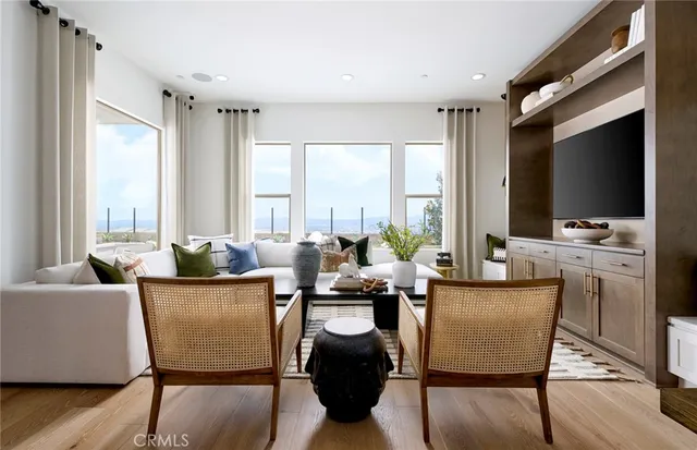 a living room with fireplace furniture and a flat screen tv