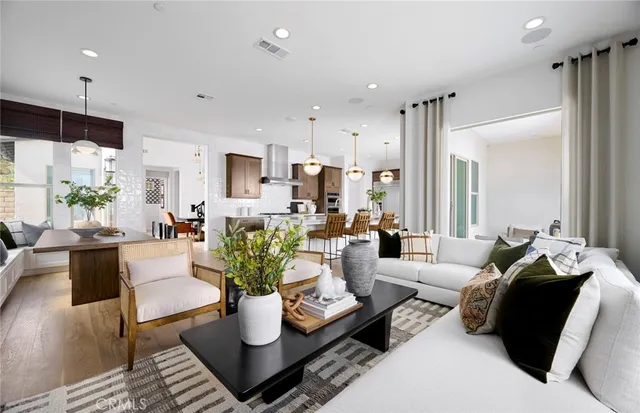 a living room with furniture or couch and a potted plant