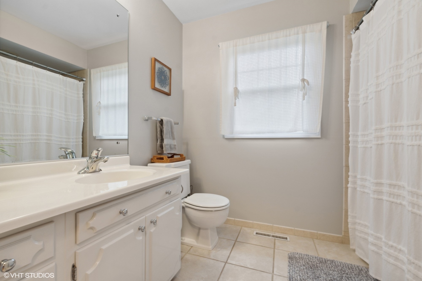 580 East Old Elm Road Lake Forest, IL 60045 - Photo 14 of 23 a bathroom with a sink a toilet and a mirror
