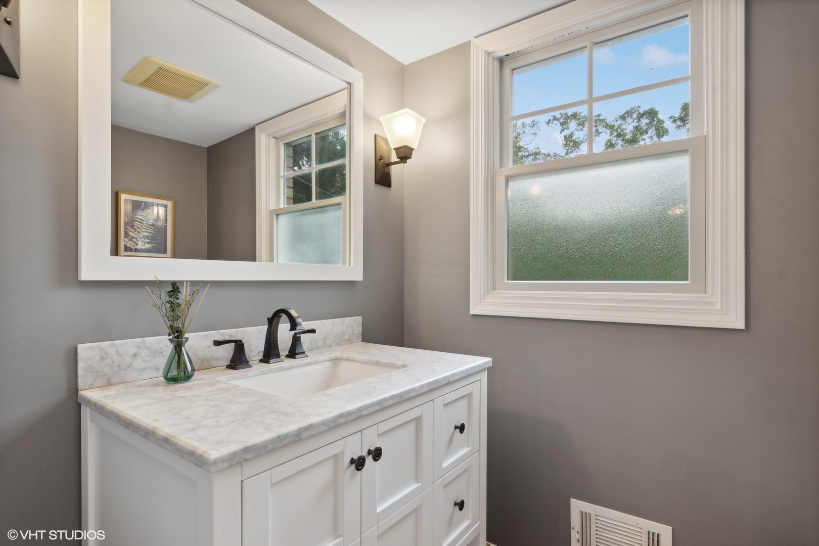 580 East Old Elm Road Lake Forest, IL 60045 - Photo 15 of 23 a bathroom with a sink a vanity and a mirror