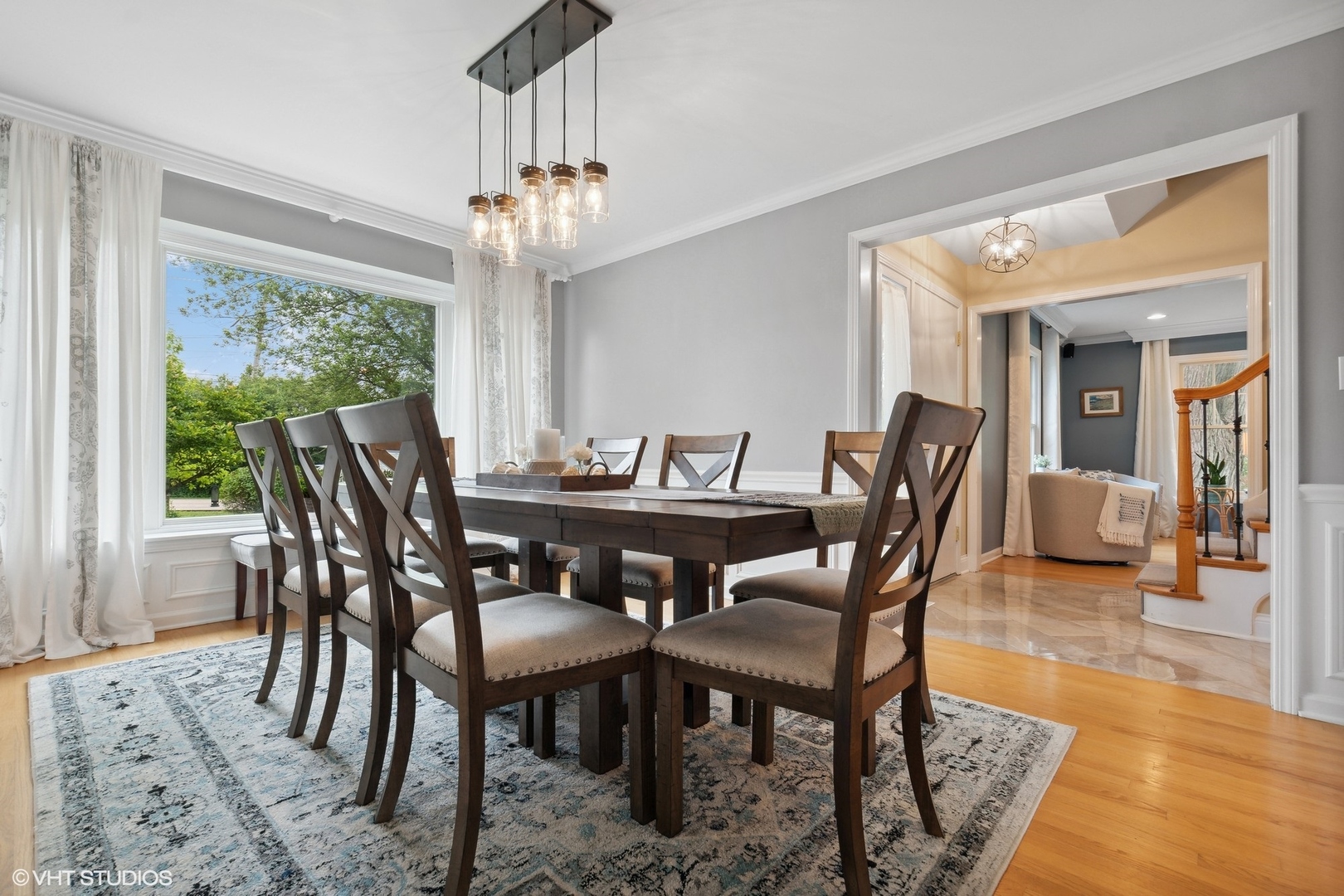580 East Old Elm Road Lake Forest, IL 60045 - Photo 9 of 23 a view of a dining room with furniture wooden floor and chandelier