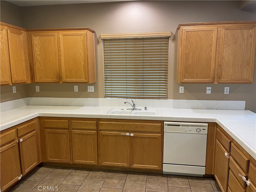 4438 Leonard Court Riverside, CA 92501 - Photo 11 of 36 a kitchen with a sink and cabinets