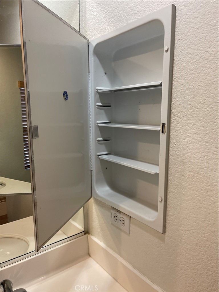 4438 Leonard Court Riverside, CA 92501 - Photo 22 of 36 a view of an empty walk in closet