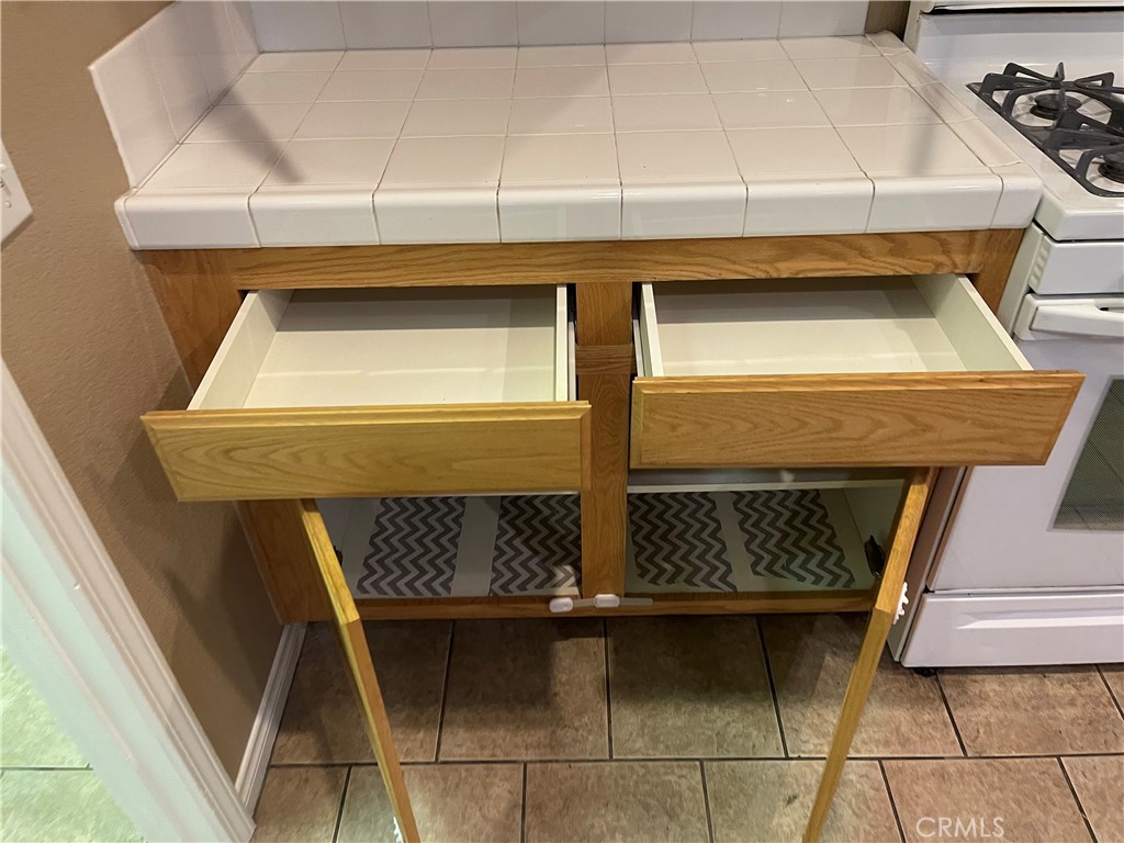 4438 Leonard Court Riverside, CA 92501 - Photo 31 of 36 a bathroom with a sink and washing machine