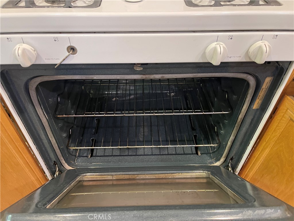 4438 Leonard Court Riverside, CA 92501 - Photo 34 of 36 a view of rack and a book shelf