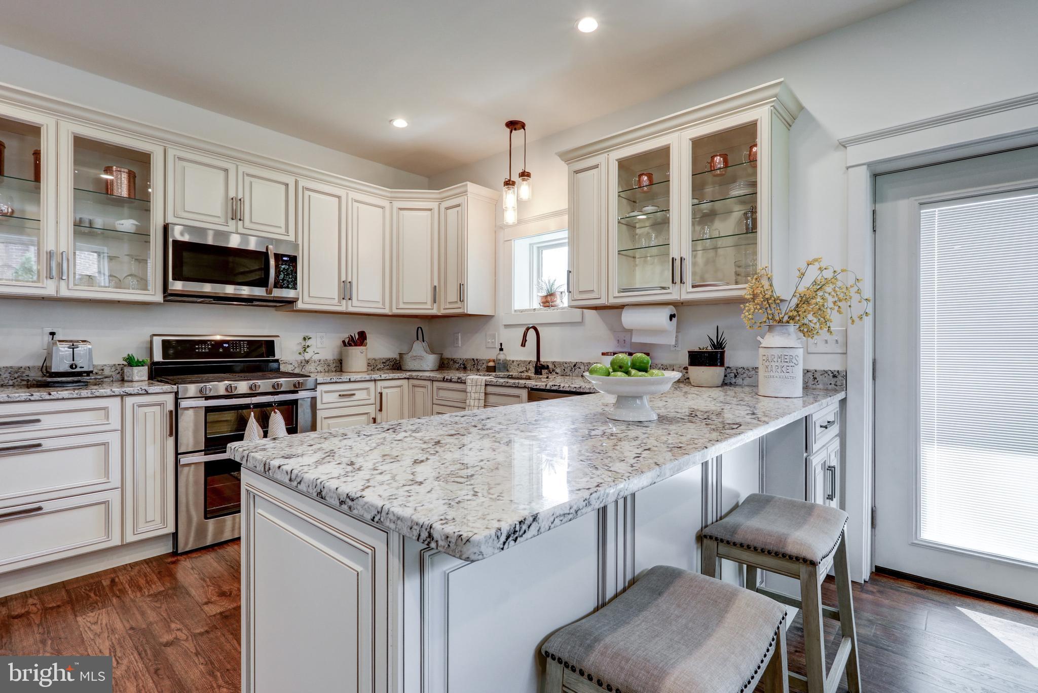 354 New Holland Avenue Lancaster, PA 17602 - Photo 12 of 43 a kitchen with granite countertop sink stove and microwave