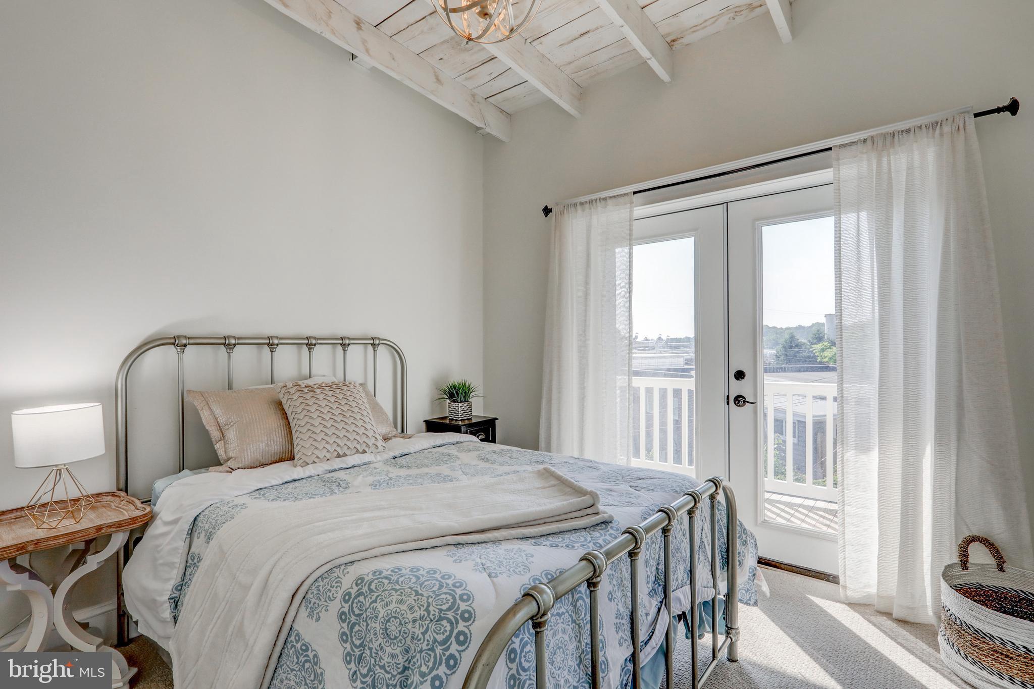 354 New Holland Avenue Lancaster, PA 17602 - Photo 29 of 43 a bedroom with a large bed and a window