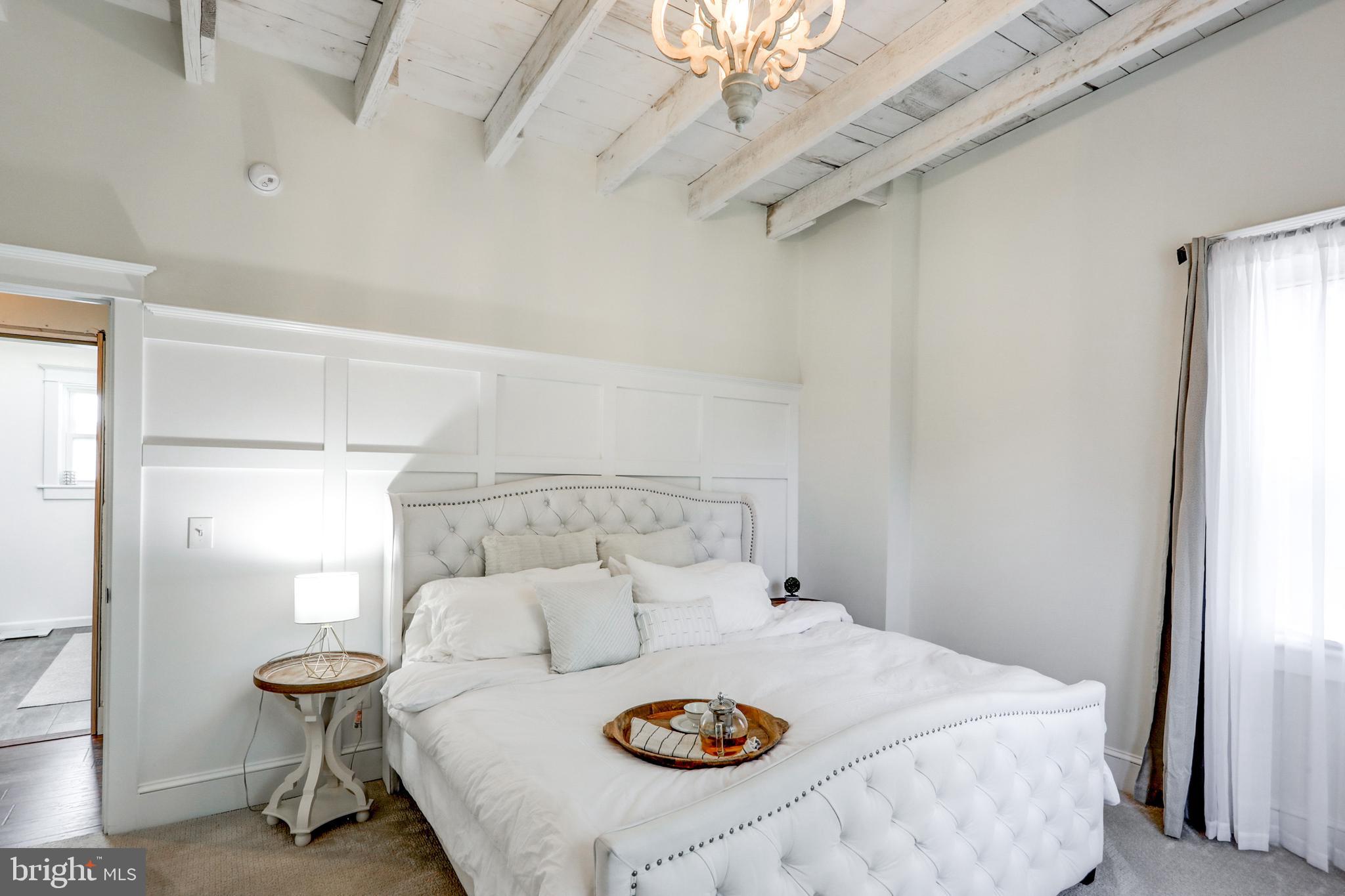 354 New Holland Avenue Lancaster, PA 17602 - Photo 31 of 43 a bedroom with a bed and a table in it