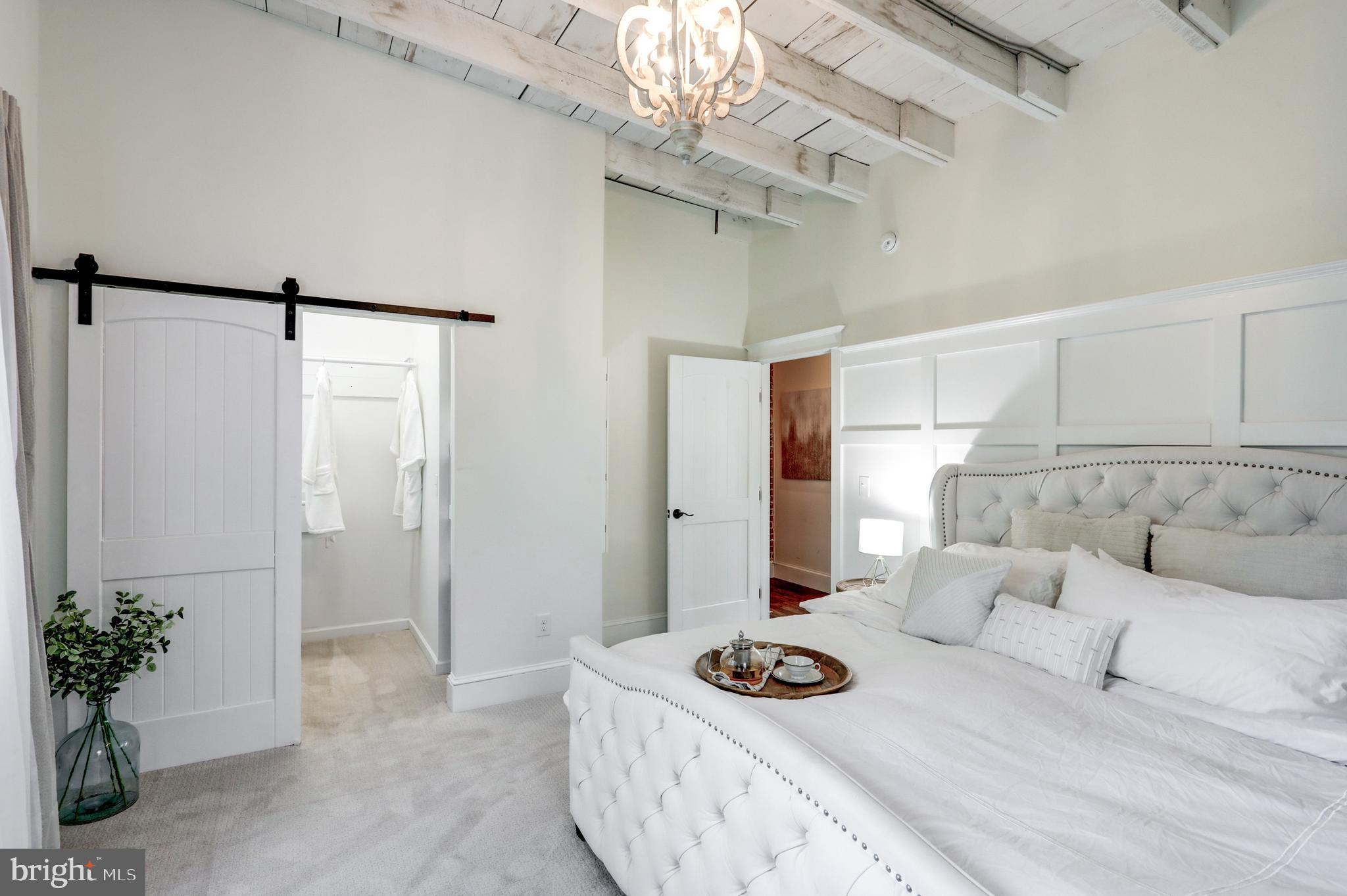 354 New Holland Avenue Lancaster, PA 17602 - Photo 33 of 43 a living room with furniture and a chandelier