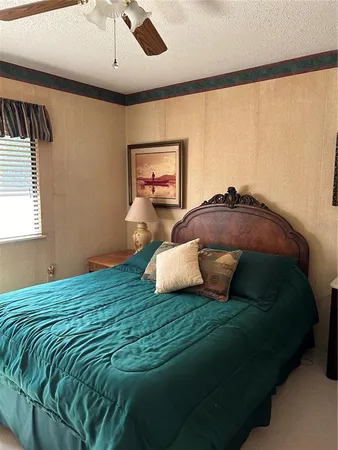 a bedroom with a bed and window