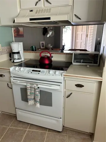 a kitchen with a stove and a sink