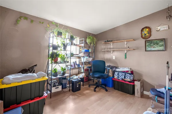 a view of a storage and utility room with washer and dryer