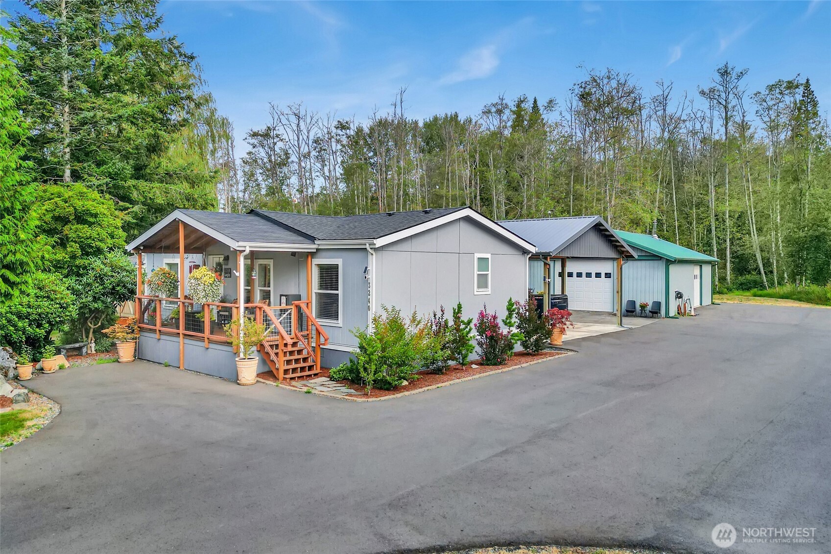 3240 Douglas Road Ferndale, WA 98248 - Photo 1 of 40 a view of a house with garden and trees