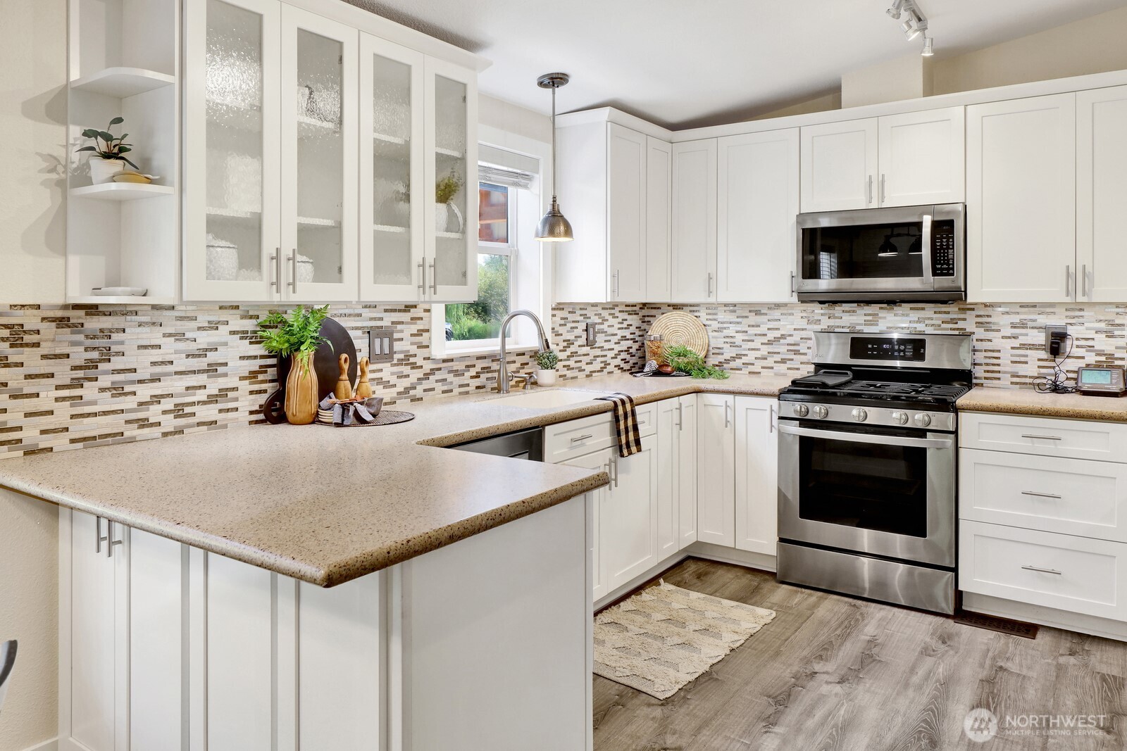 3240 Douglas Road Ferndale, WA 98248 - Photo 22 of 40 a kitchen with stainless steel appliances a stove sink microwave and cabinets