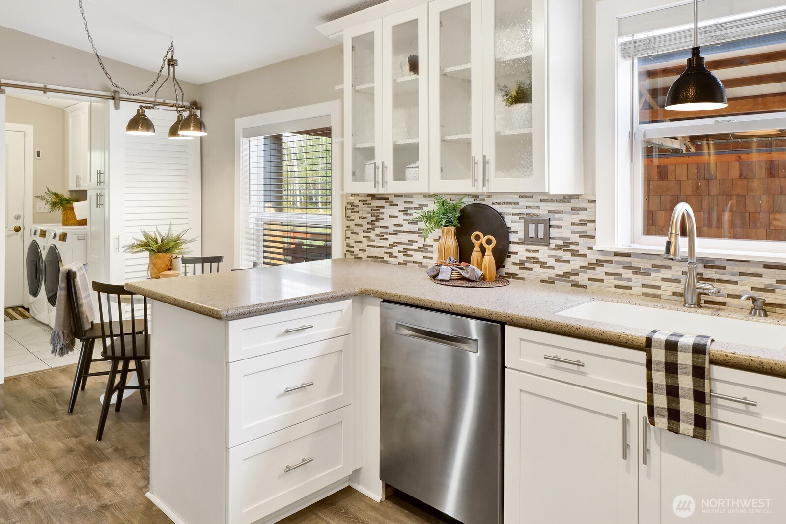 3240 Douglas Road Ferndale, WA 98248 - Photo 23 of 40 a kitchen with stainless steel appliances granite countertop white cabinets and window