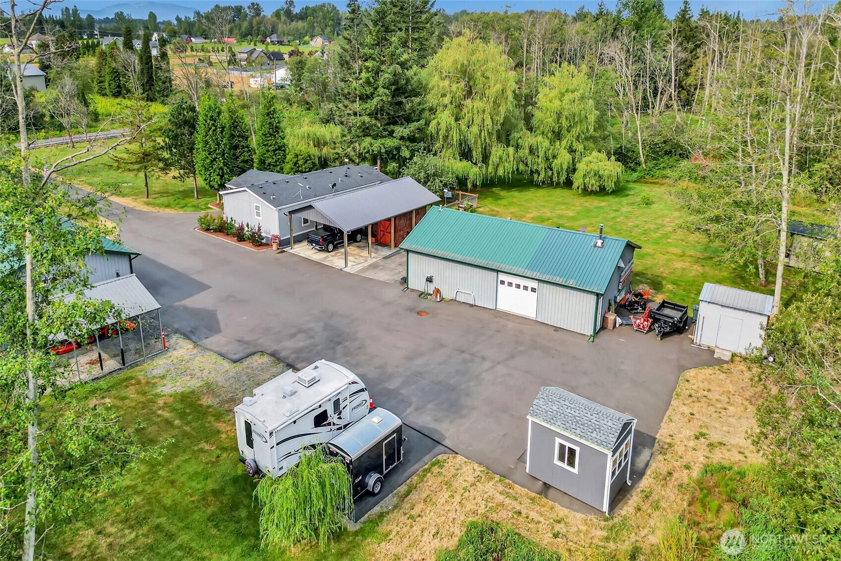 3240 Douglas Road Ferndale, WA 98248 - Photo 34 of 40 an aerial view of a house with yard swimming pool and outdoor seating