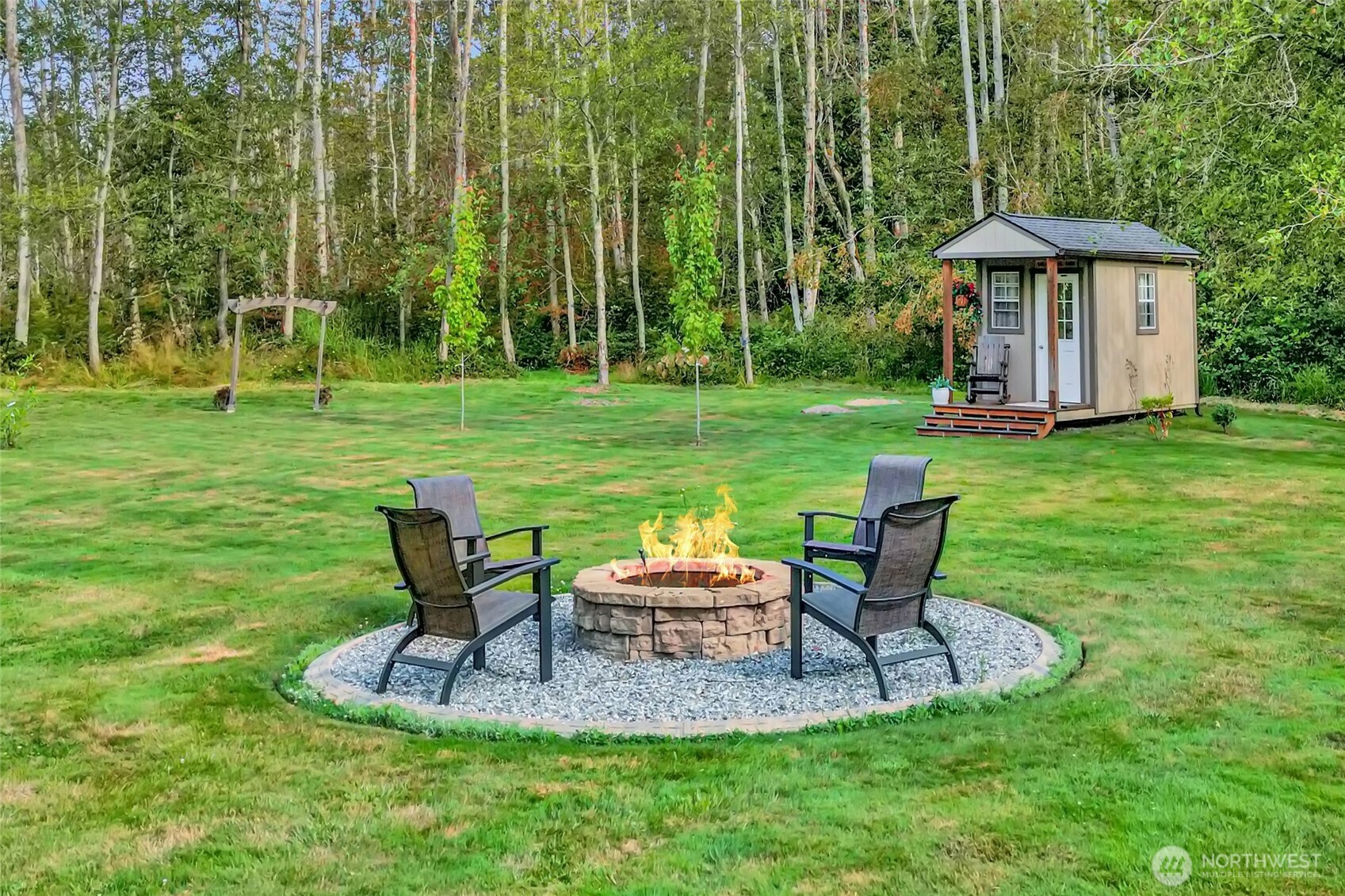 3240 Douglas Road Ferndale, WA 98248 - Photo 35 of 40 a backyard of a house with table and chairs