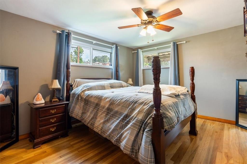 12490 Adams Drive Irwin, PA 15642 - Photo 11 of 33 a bedroom with a large bed and a ceiling fan