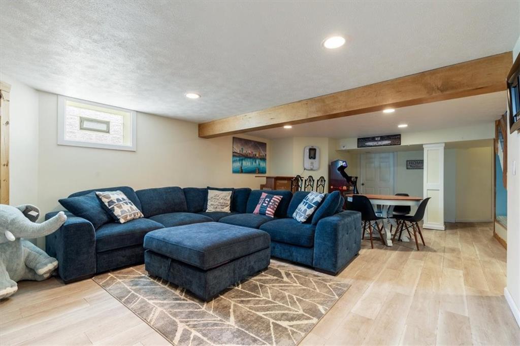 12490 Adams Drive Irwin, PA 15642 - Photo 16 of 33 a living room with furniture and a dining table with wooden floor