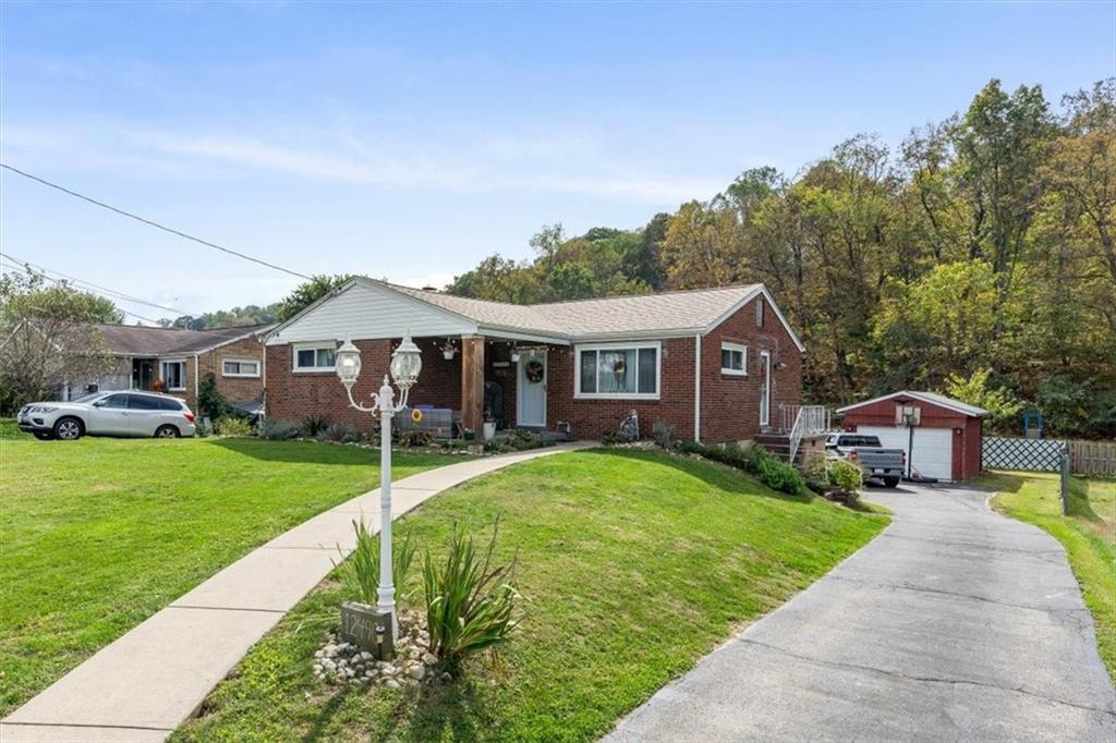 12490 Adams Drive Irwin, PA 15642 - Photo 2 of 33 a front view of a house with yard porch and green space