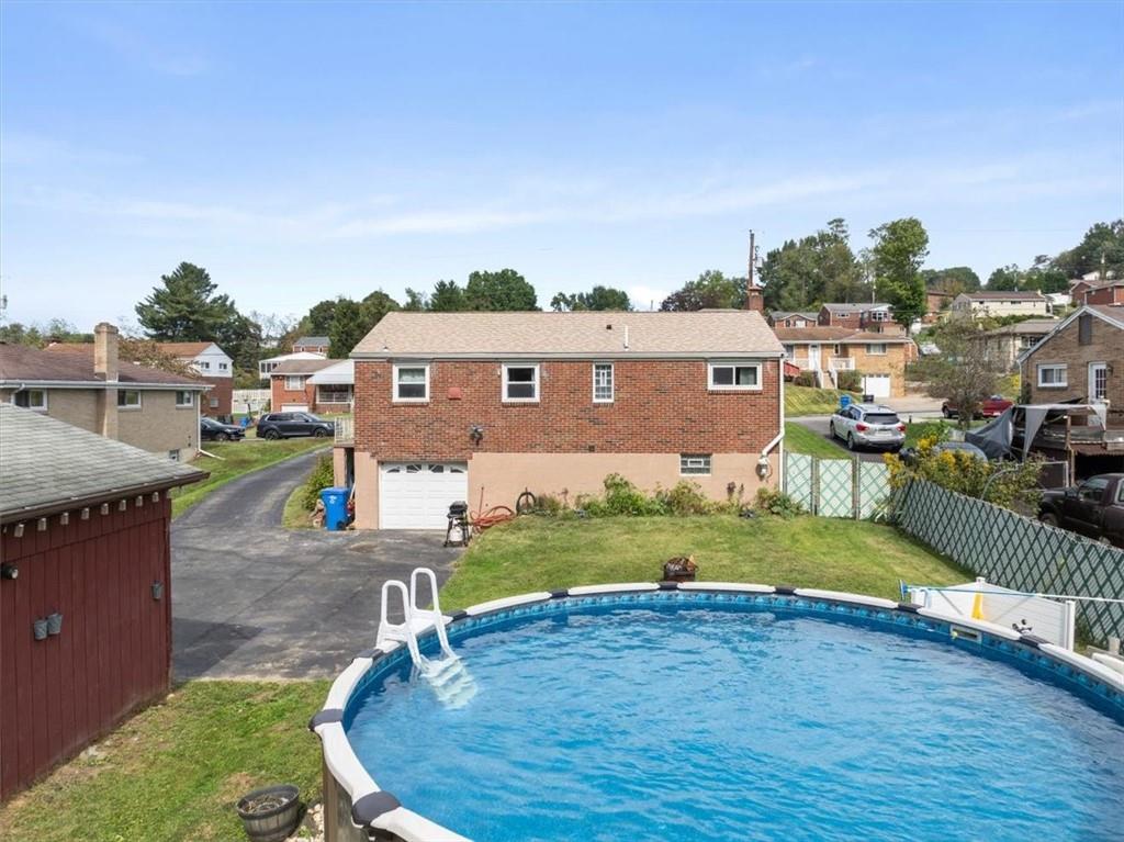 12490 Adams Drive Irwin, PA 15642 - Photo 23 of 33 a view of swimming pool in front of residential houses