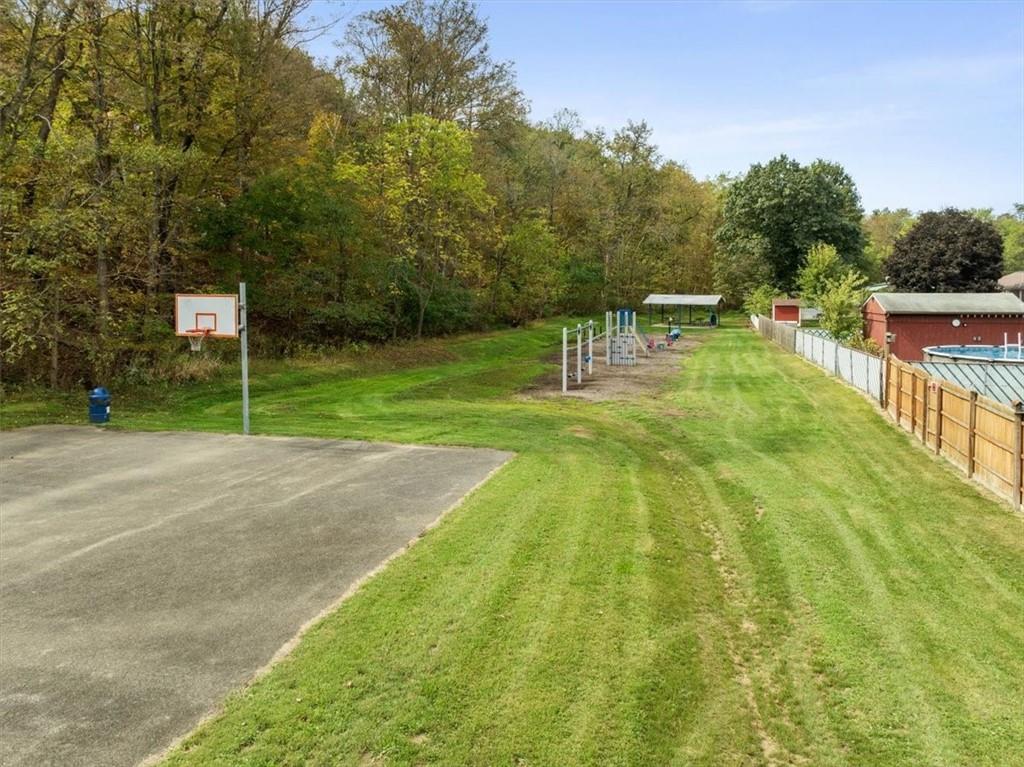 12490 Adams Drive Irwin, PA 15642 - Photo 27 of 33 a swimming pool with a garden and trees