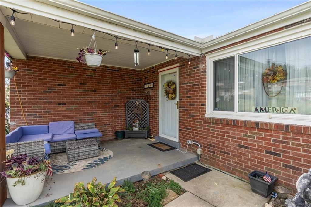 12490 Adams Drive Irwin, PA 15642 - Photo 3 of 33 a brick building with a bench in front of it