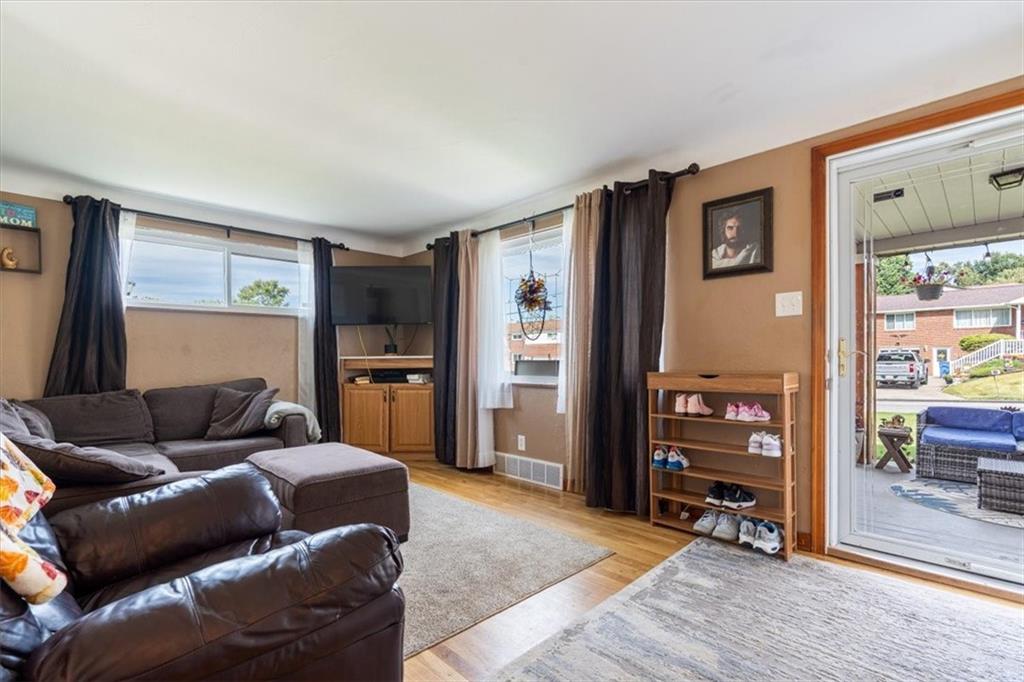 12490 Adams Drive Irwin, PA 15642 - Photo 4 of 33 a living room with furniture and a wooden floor