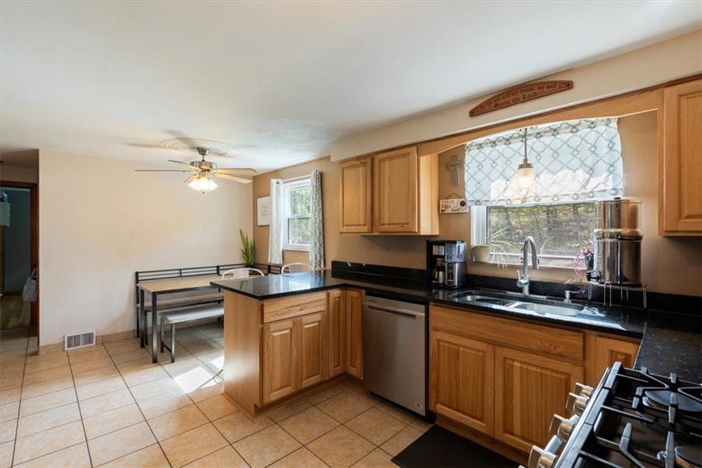 12490 Adams Drive Irwin, PA 15642 - Photo 8 of 33 a kitchen with stainless steel appliances a sink stove and cabinets